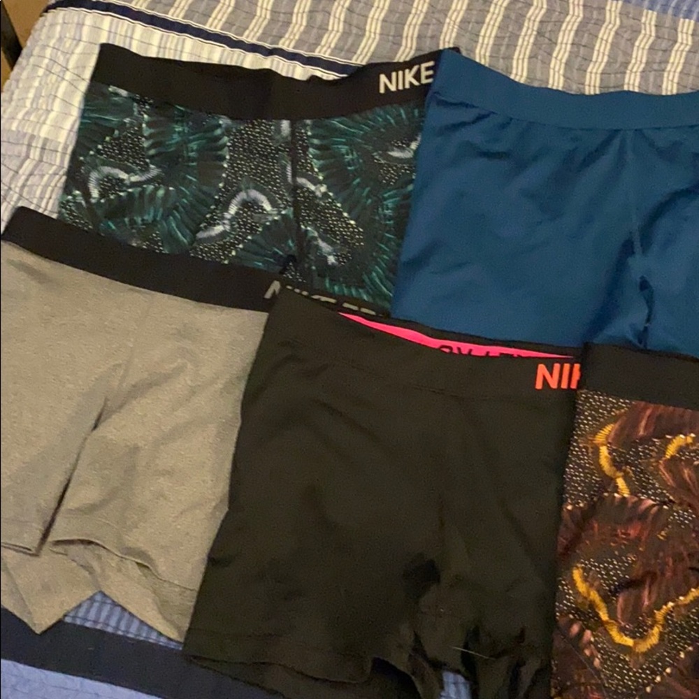 7 pairs of Nike pro shorts